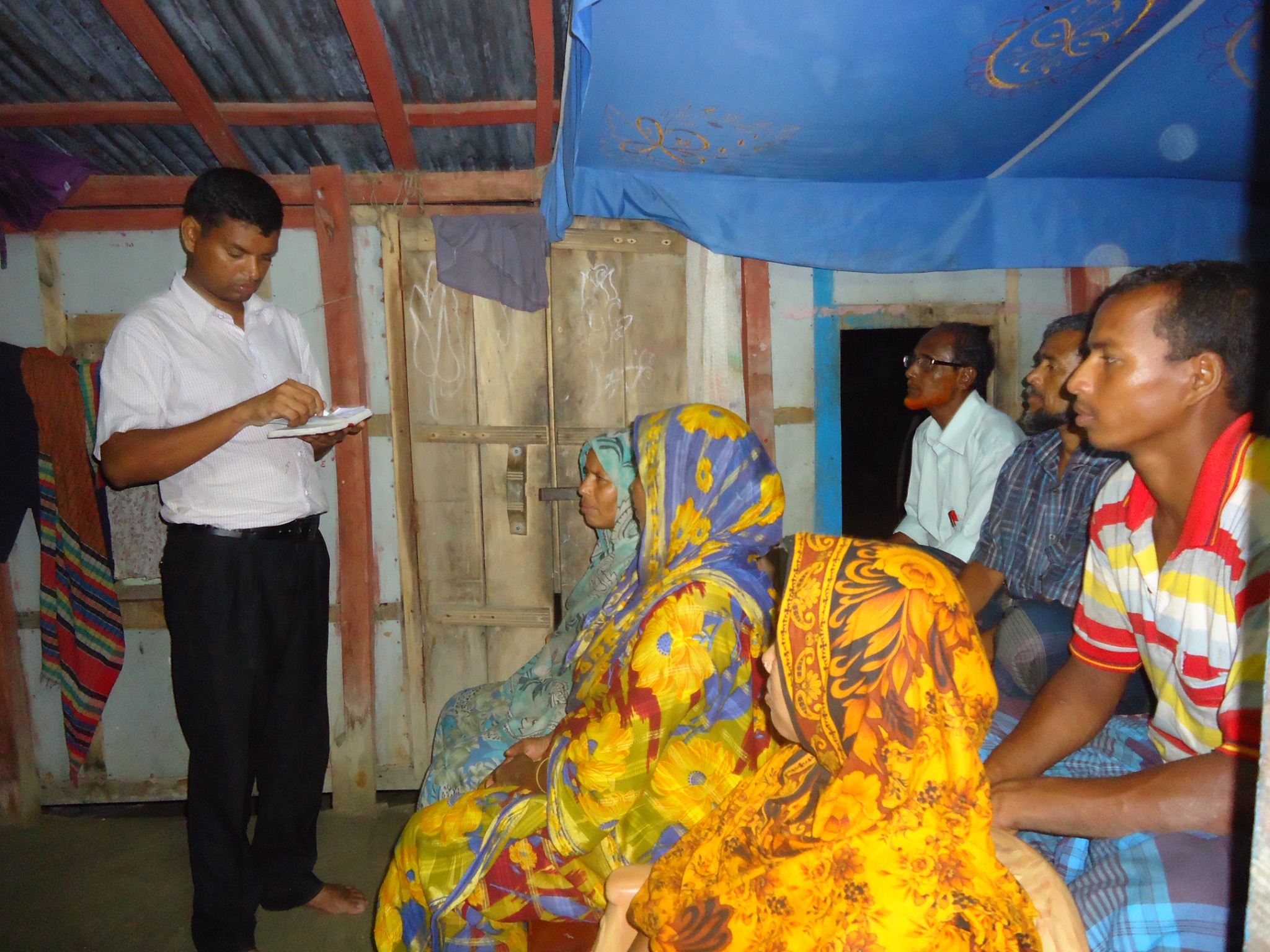A small group gathered indoors for teaching and fellowship