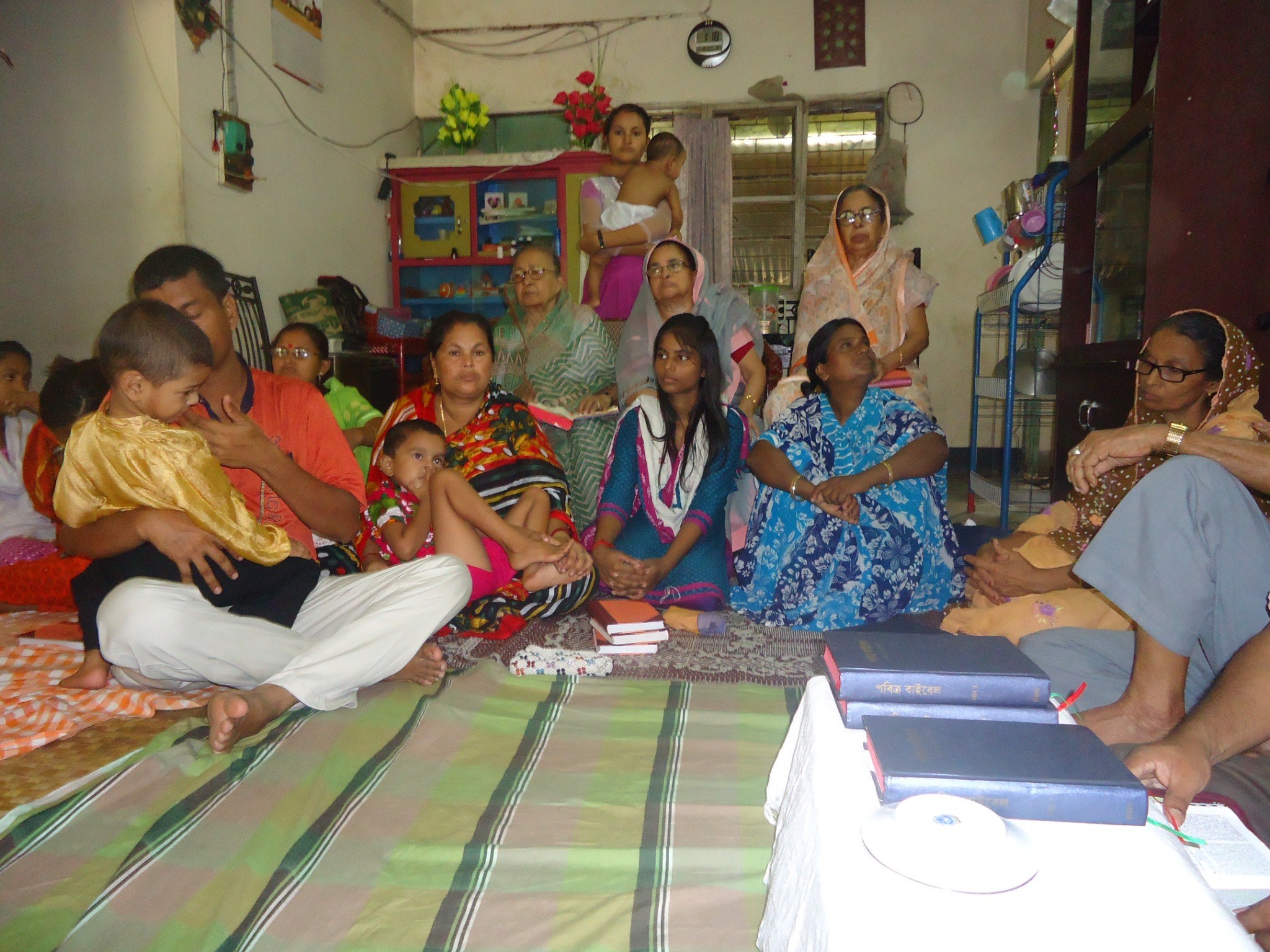 A family and community group gathered together