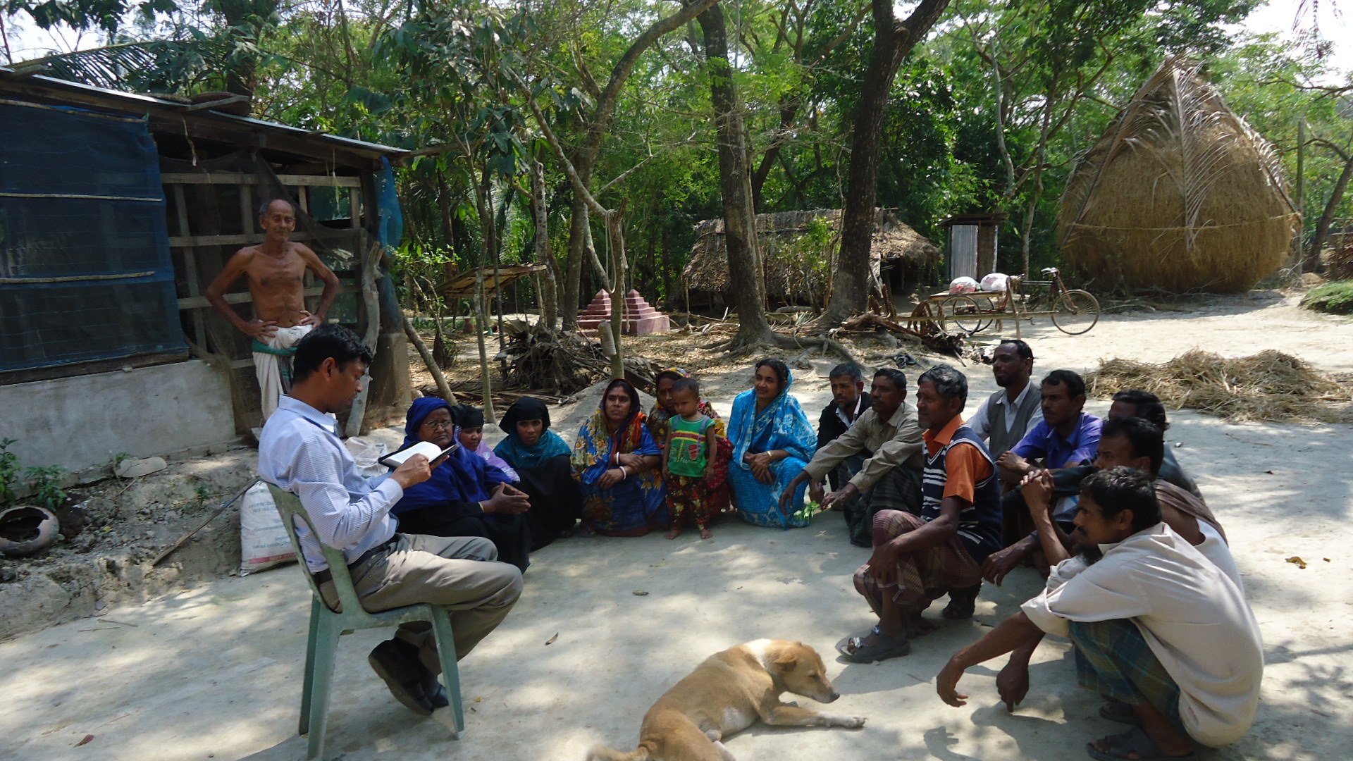 A village community gathered outdoors for fellowship